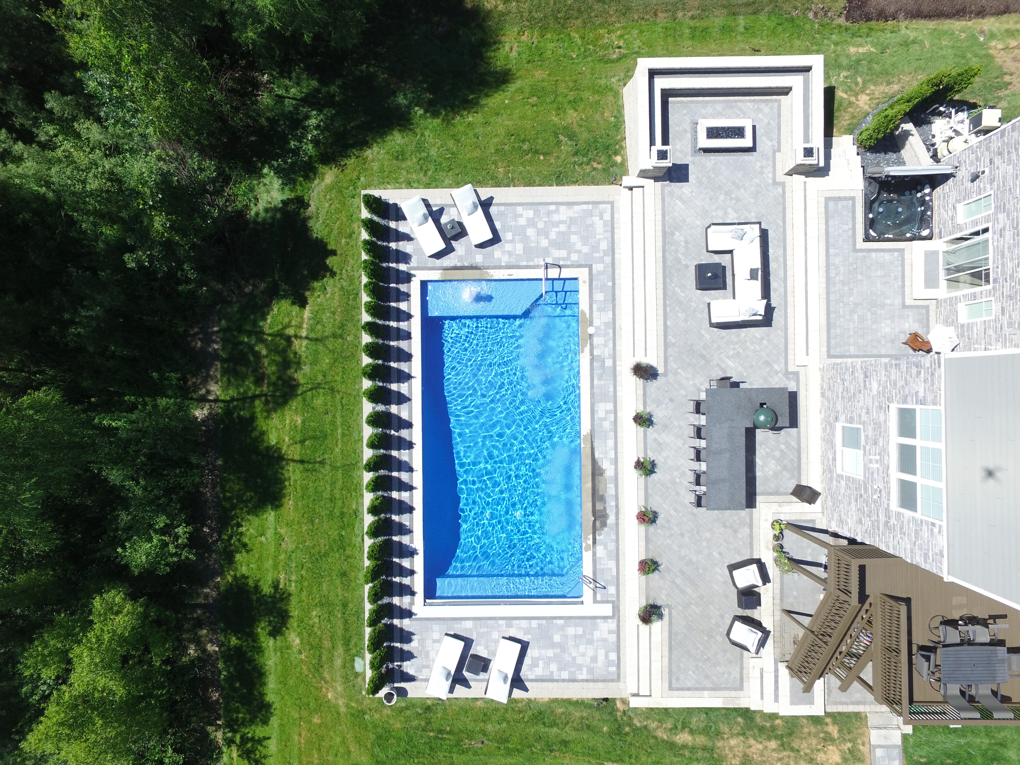 Aerial top-down view of modern residential pool area